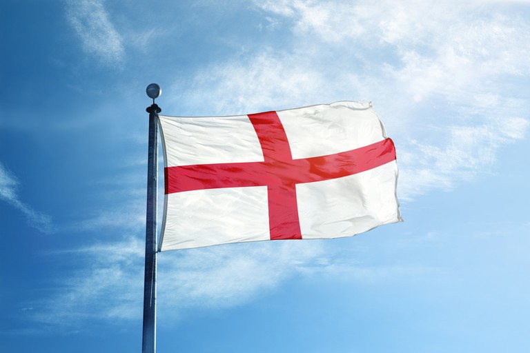 England Flag Against Blue Sky