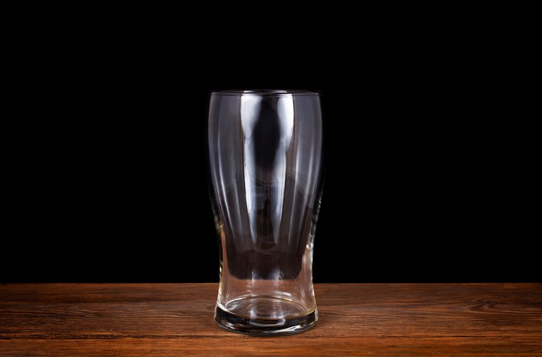 Pint Glass on Wooden Table