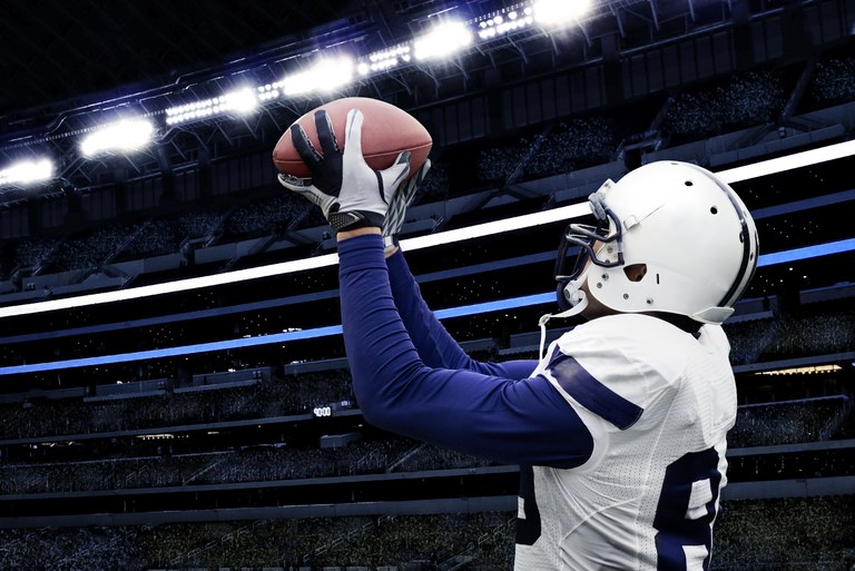 American Footballer Catching Ball