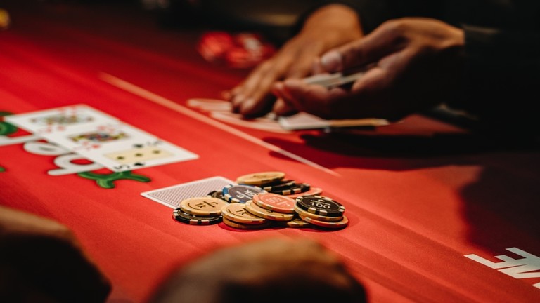 Chips and Cards on Red Poker Table