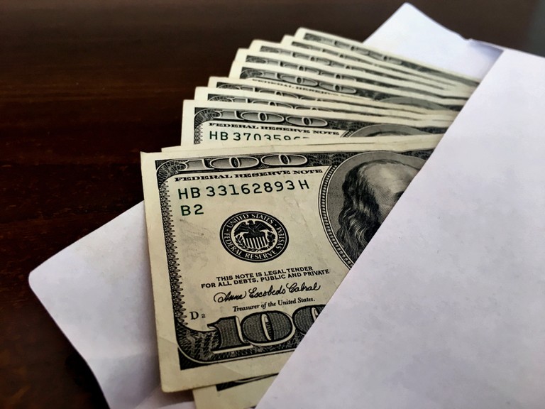 100 Dollar Bills in Envelope Close Up