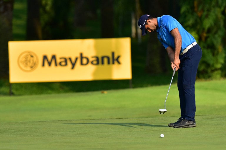 Aaron Rai Attempting Putt