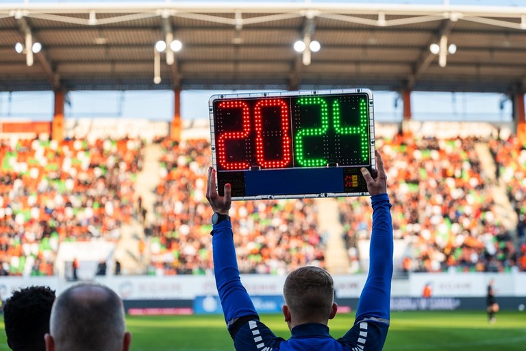Fourth Official Holding Up Substitute Board